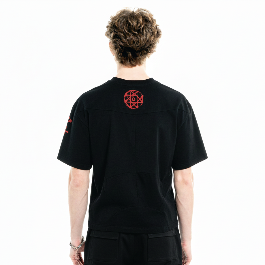 Back on-body view of the black Armor Tee with sizing guidance.
