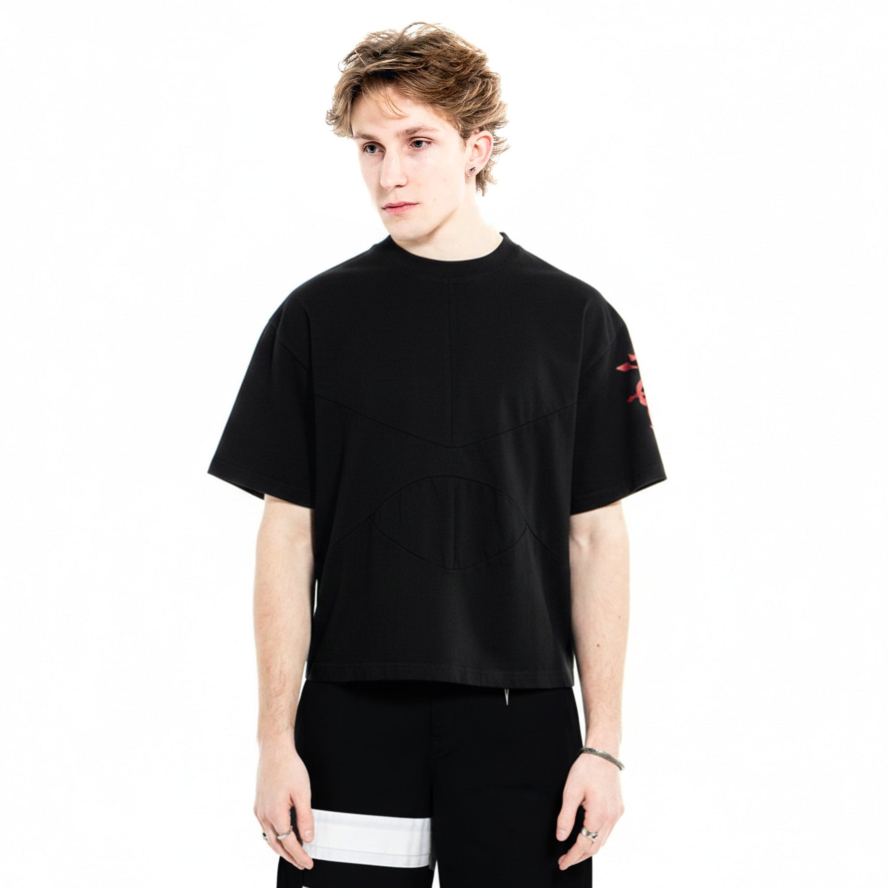 Front on-body view of the black Armor Tee with sizing guidance.