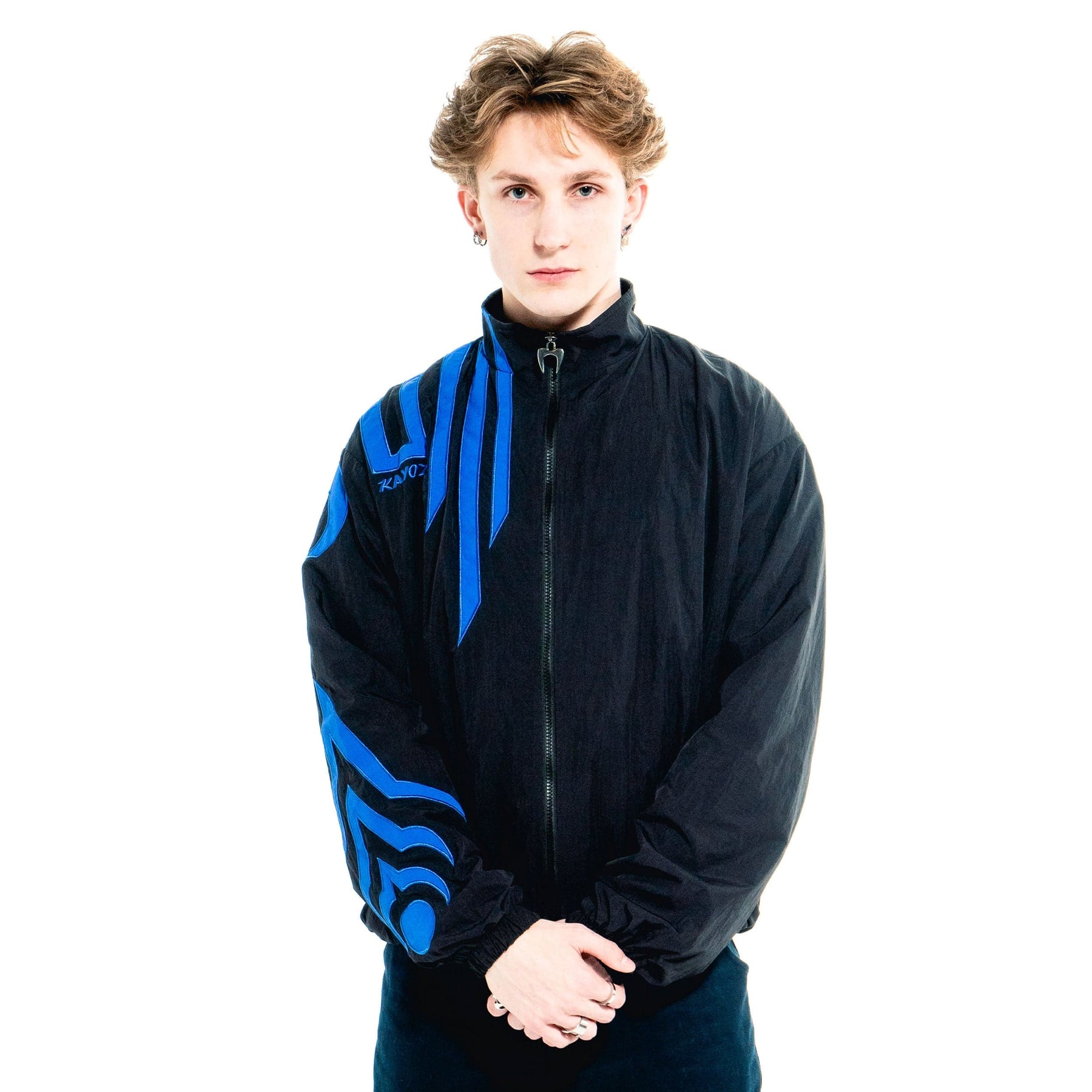 Front on-body view of the blue Karma Jacket with sizing guidance.
