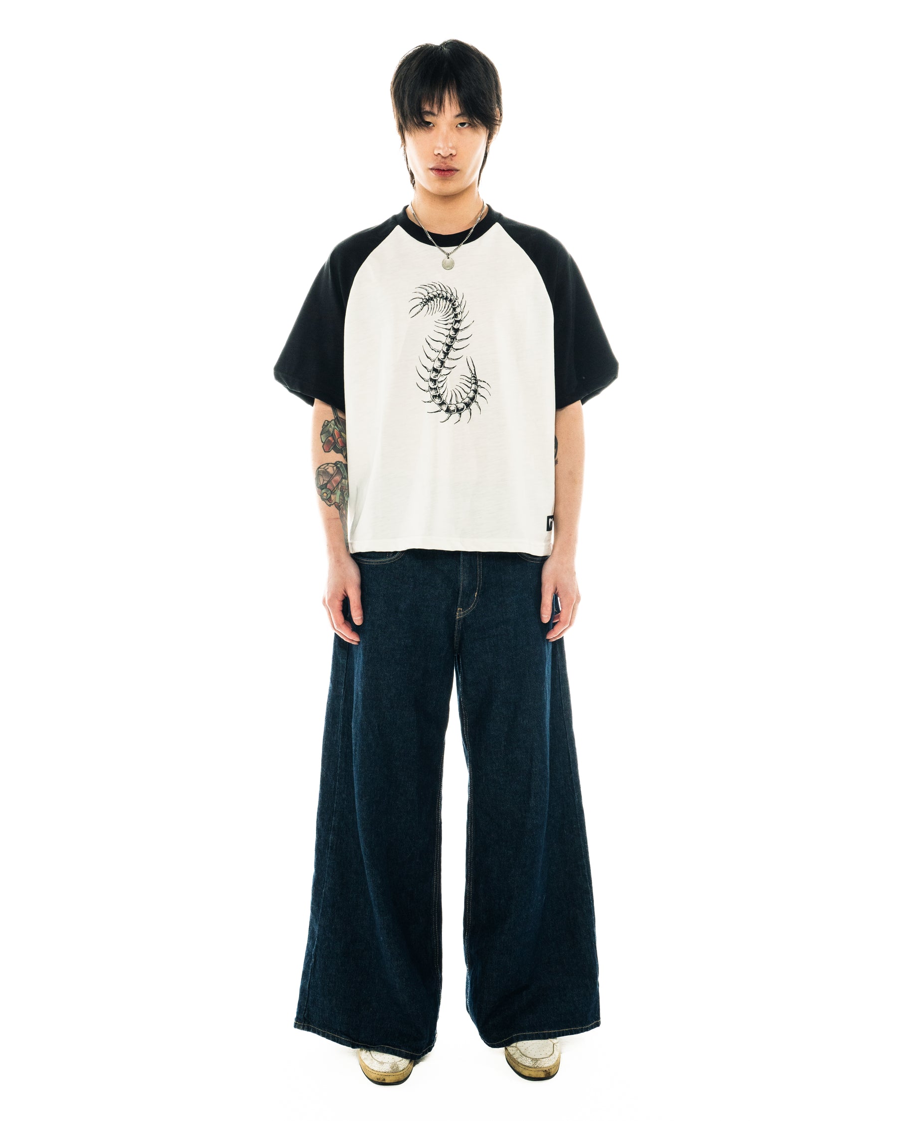 Front on-body view of the Centipede Tee with sizing guidance.