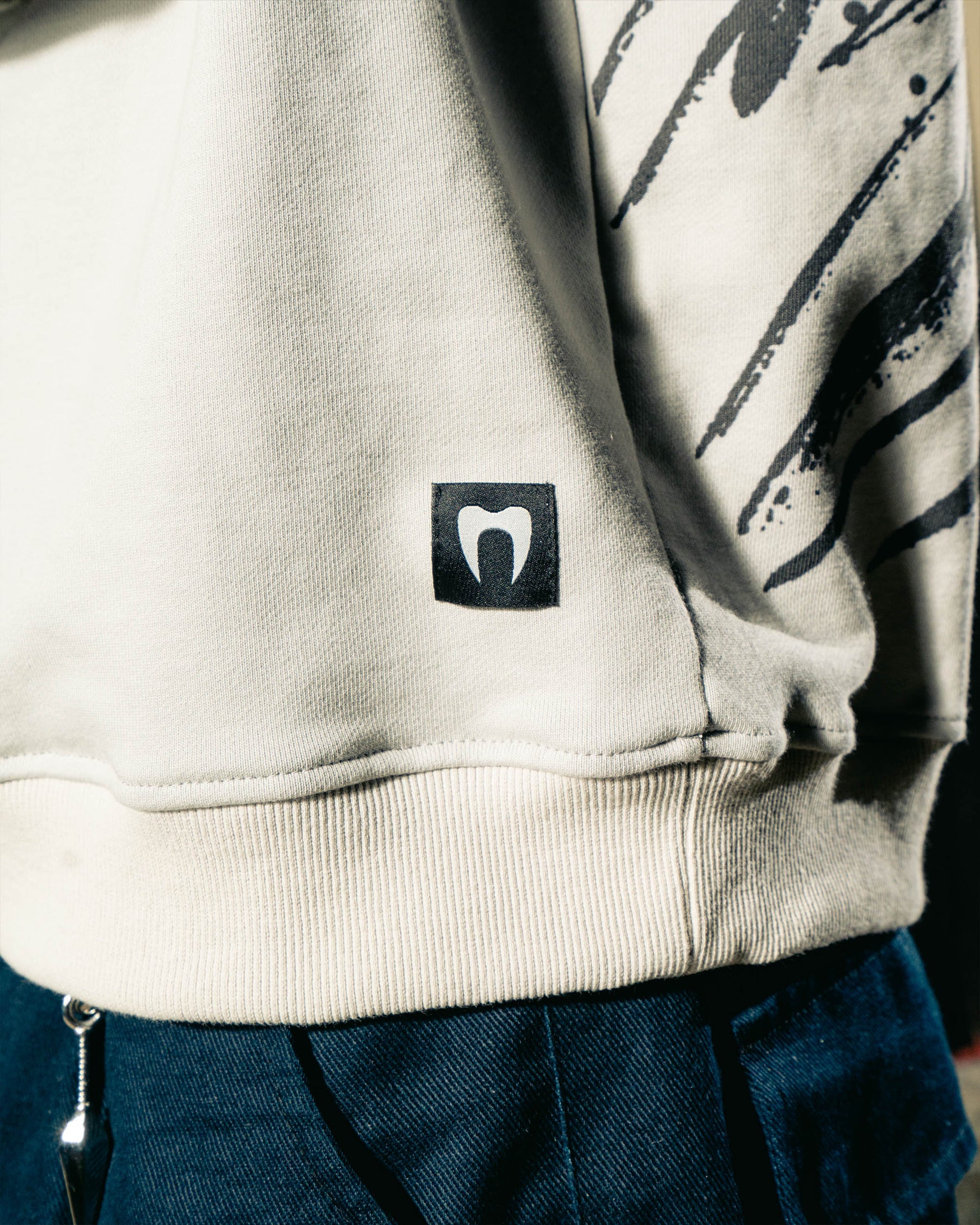 REAPER CREWNECK on-body detail view