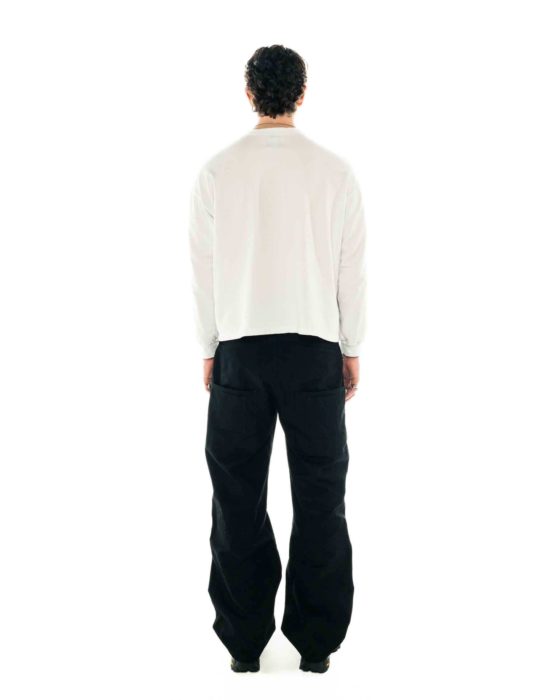 Back on-body view of the Rebirth Long Sleeve with sizing guidance.